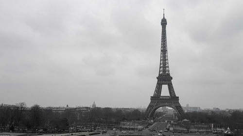 Tower of building against cloudy sky