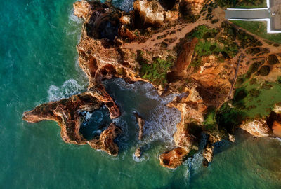 High angle view of rock formation in sea