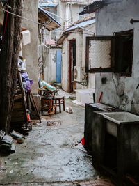 Empty alley amidst buildings in town