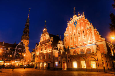 Low angle view of illuminated cathedral at night