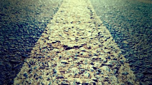 Close-up of cracked road