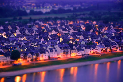 Aerial view of illuminated houses in town