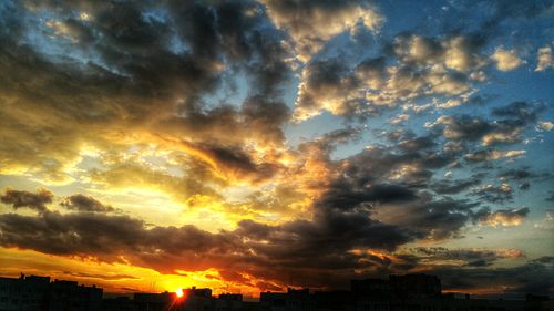 Scenic view of dramatic sky during sunset