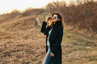 Young woman standing on land