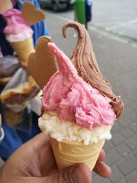 Cropped image of hand holding ice cream