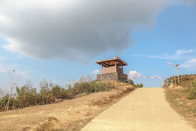 Built structure on land against sky