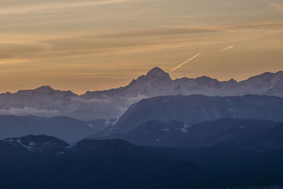 Scenic view of mountains against sky during sunset