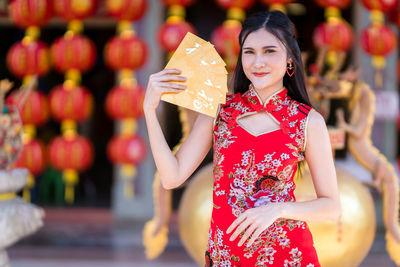 Portrait of smiling woman at temple