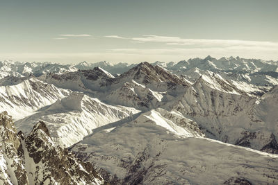 Scenic view of snowcapped mountains against sky