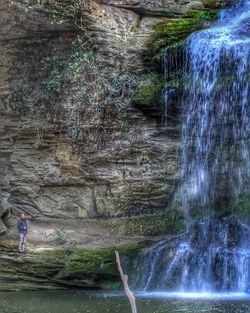 Woman standing on rocks