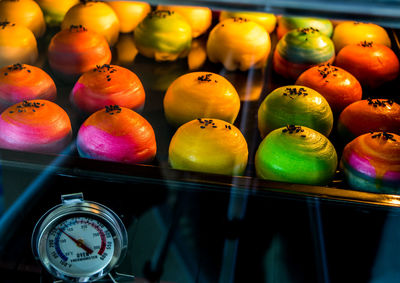 High angle view of multi colored candies in container