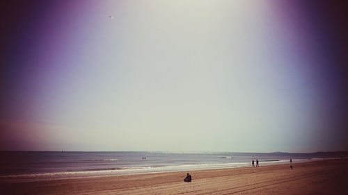 Scenic view of beach against clear sky