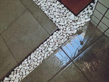 High angle view of stones on footpath