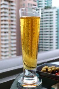 Close-up of beer glass on table