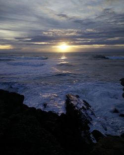 Scenic view of sea against sky at sunset