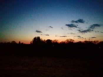 Silhouette trees against sky during sunset