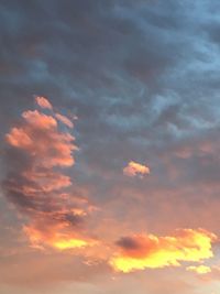 Low angle view of cloudy sky during sunset