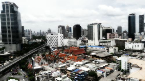 High angle view of city against cloudy sky