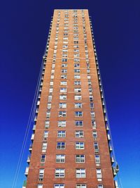 Low angle view of building against clear blue sky