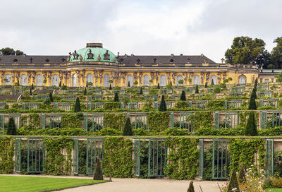 View of old building against cloudy sky