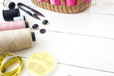 High angle view of sewing items on table