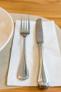 Close-up of fork and spoon on table