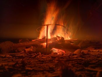 Bonfire on wooden structure at night