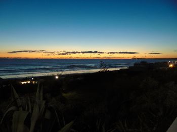 View of beach at sunset