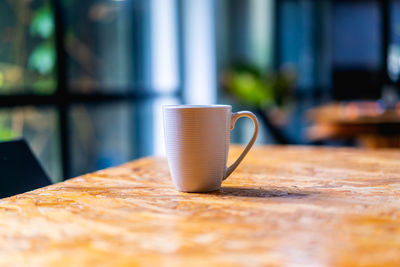 Close-up of coffee cup on table