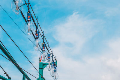 Low angle view of ferris wheel against sky