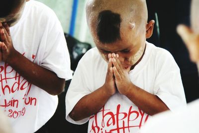 Boys praying at temple