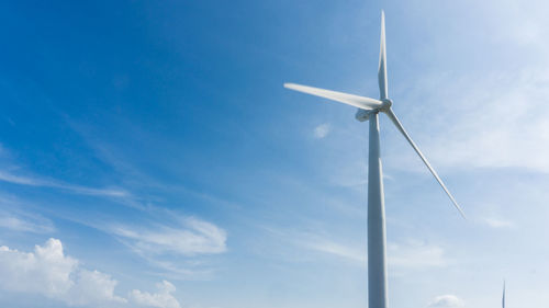 Low angle view of wind turbine against sky