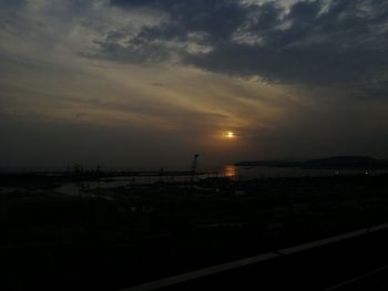 Scenic view of silhouette bridge against sky at sunset