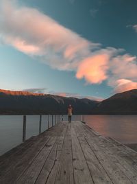 Scenic view of pier on lake against sky