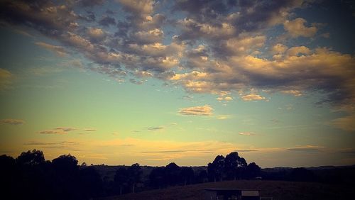 Scenic view of landscape at sunset