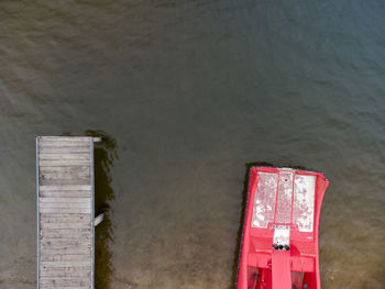 Text on old wall by water