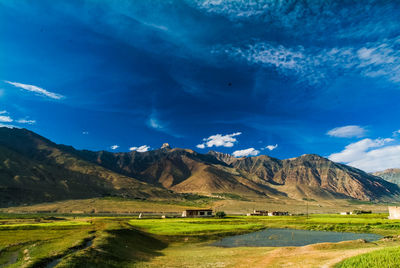 Scenic view of landscape against blue sky at night