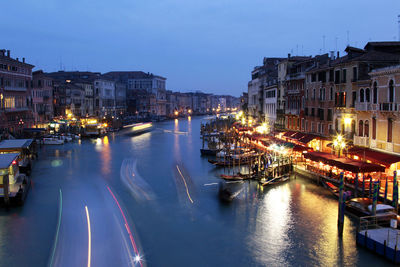 View of boats moored at canal