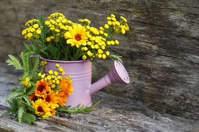 Close-up of yellow flowers on table