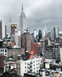 Modern buildings in city against sky