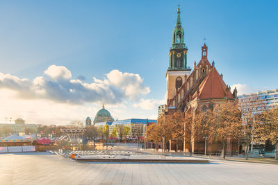 Buildings in city against sky