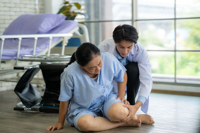 High angle view of mother and daughter at home