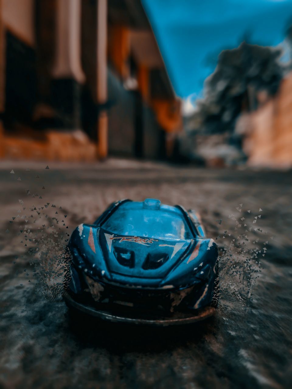 HIGH ANGLE VIEW OF TOY CAR ON TABLE