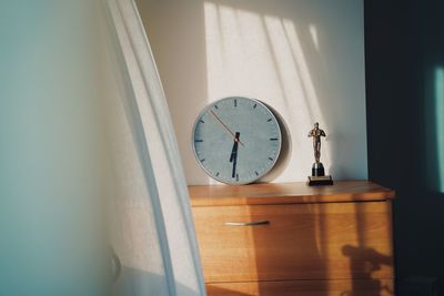 Close-up of clock on table