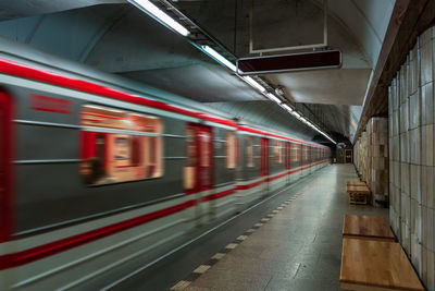 Blurred motion of train at railroad station