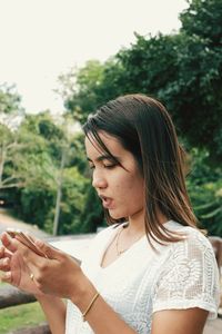 Beautiful young woman looking at camera