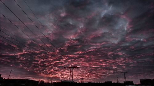 Low angle view of silhouette dramatic sky during sunset