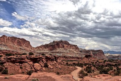 Rocky landscape against clouds