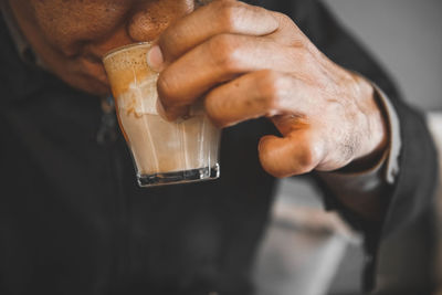 Close-up of man holding ice cream