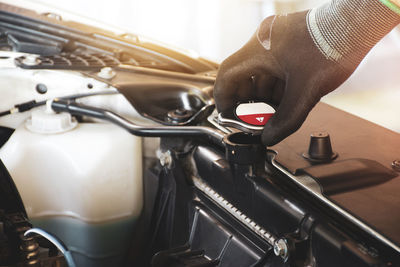 Close-up of hand holding car